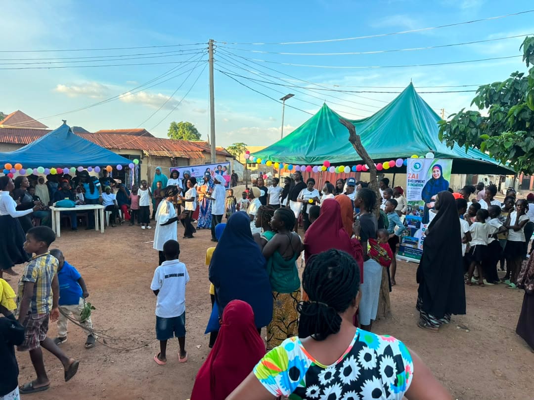Participants gather near the canopies as the session winds down